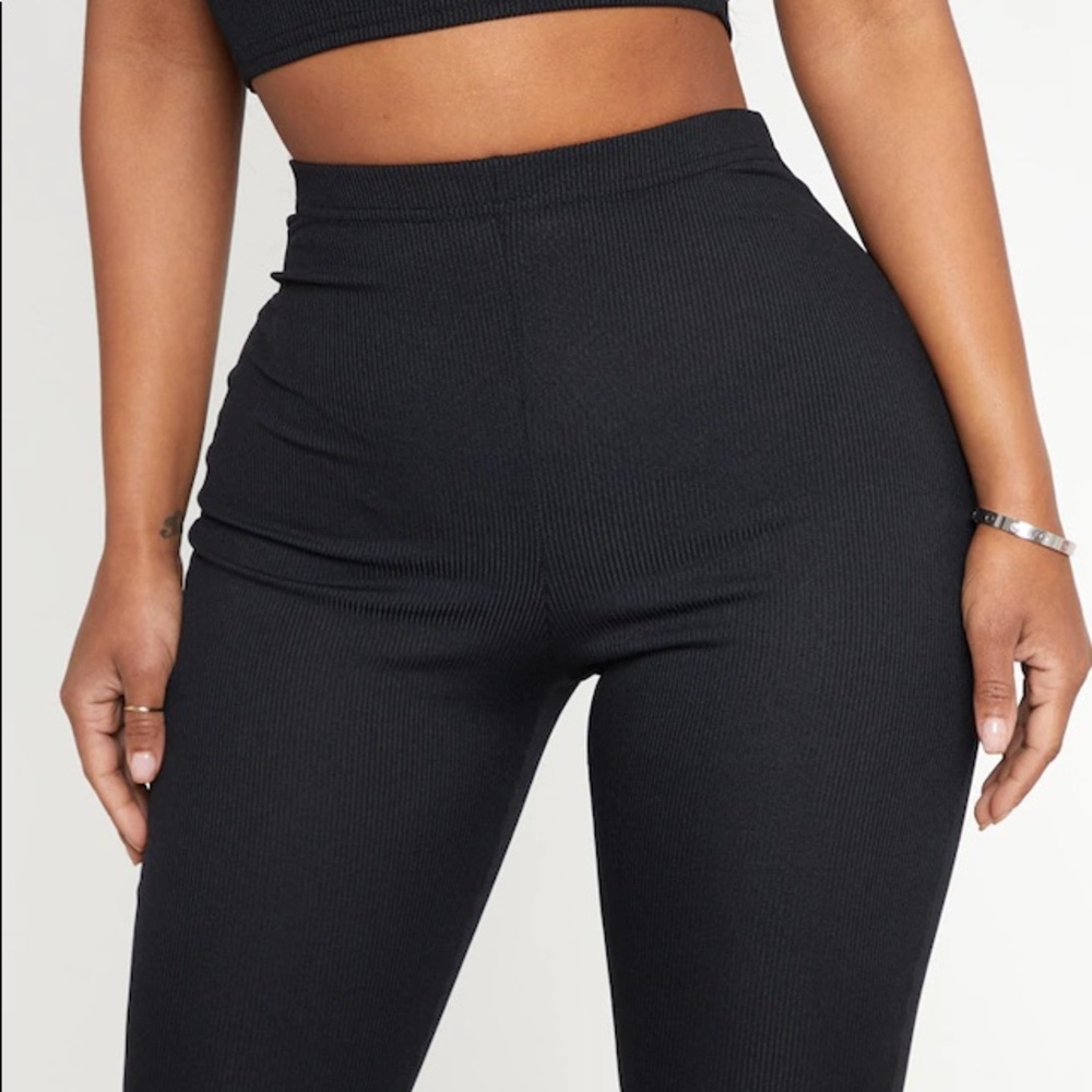 PRETTYLITTLETHINGS Black Ribbed flare trousers